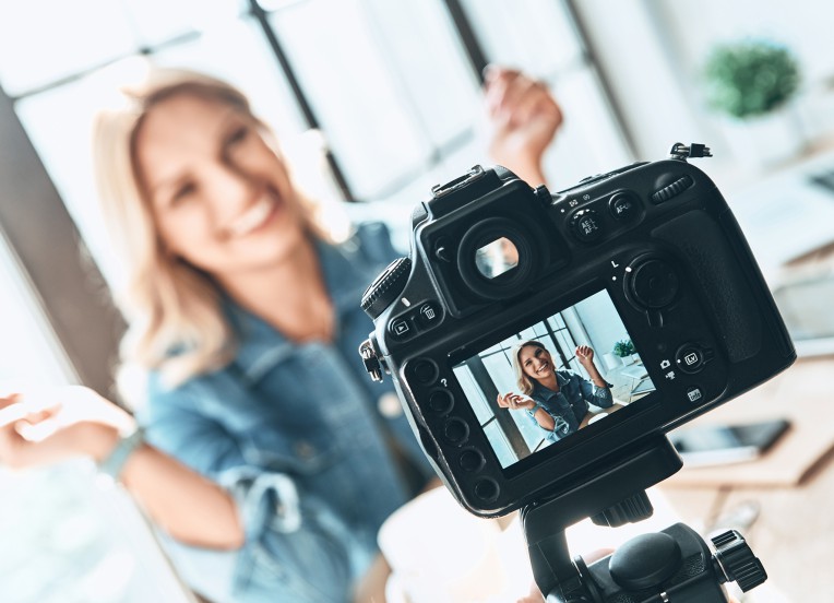 Woman taking picture with camera
